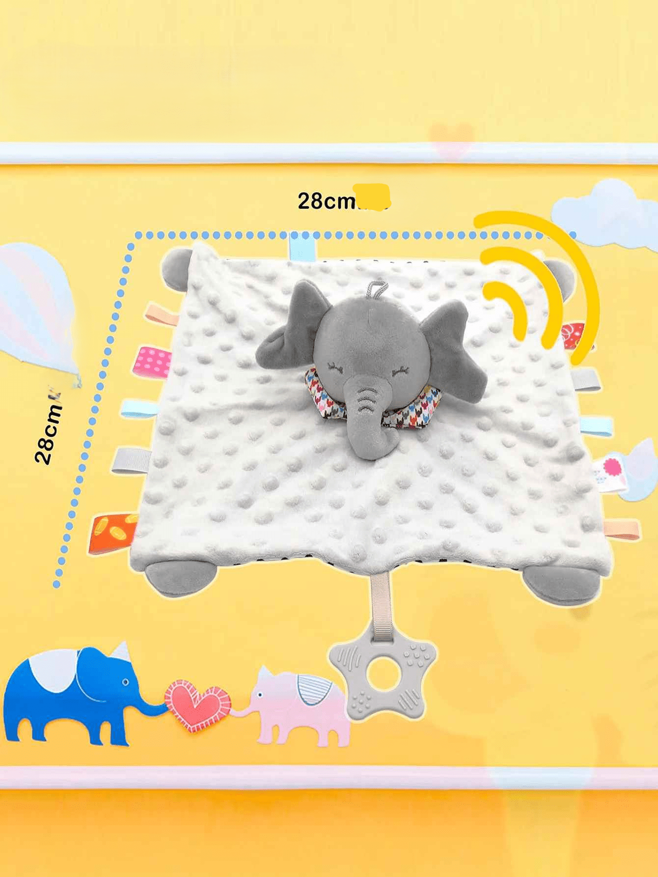 doudou éléphant sur un fond orange qui montre la forme carre et les dimensions avec tout les petits accessoires