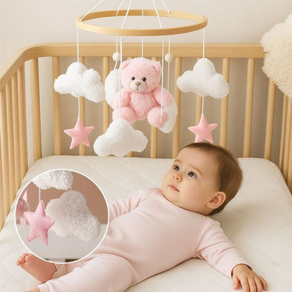 mobil pour lit bebe nouveau née allonger dans son lit avec les petits sujets qui bouge et qui essaye de redresser sa tête