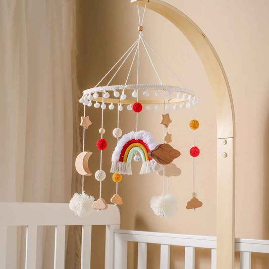 mobile bebe pour lit suspendu au bras de maintien au dessus du berceau